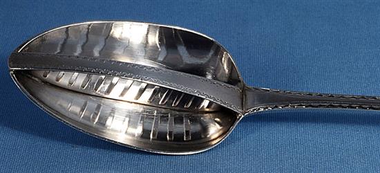 A George III Irish silver strainer spoon, by John Osborne, Length; 315mm Weight: 4.5oz/140 grms